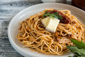 Italian Pasta with sun-dried tomato pesto and brie cheese.