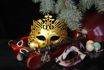 Carnival masks, mandolin, spruce branch and decorations.