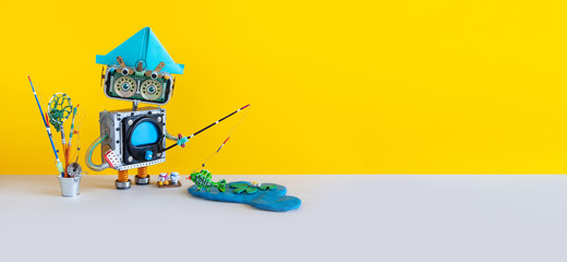 Fishing game. Robotic toy angler fisherman with fishing rod catches fish in a pond. blue lake,...