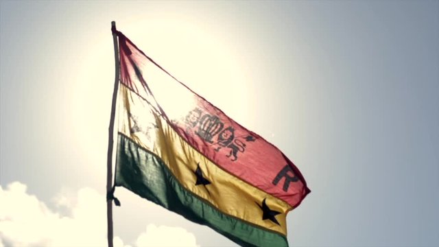 Rastafarian Flag waving in the afternoon sun.