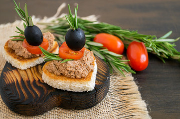 fried bread with meat pate in the shape of a heart.