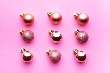 Christmas background. Xmas balls isolated on pink. Bubble pattern decoration. Flat lay. Winter concept