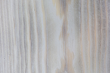 The surface of cracked board, bark is used as natural background. Grunge peeling wood texture.