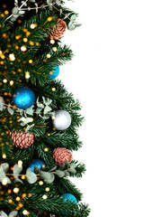 Banches of pine tree on white background with christmas balls and pine cones. Place for text.