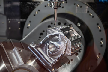High precision CNC machining center machine cutting sample workpiece. Industrial metalworking machinery