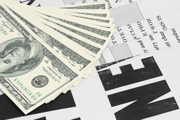 Obraz premium Old Newspapers and Money. News Pages with Headlines and One Hundred Dollar Bills. Magazines and US Currency in Cash. Business and Finance Background 