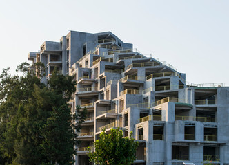 Uncompleted building, unfinished construction. Work in progress  high-rise house with grey facade.