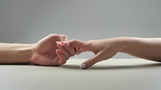 a man holds a female hand but she slips away 4k
