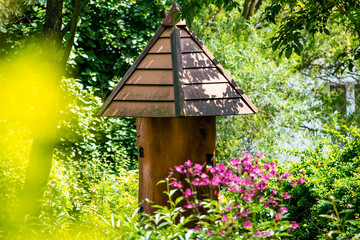 Beehive made of tree trunk in the city park