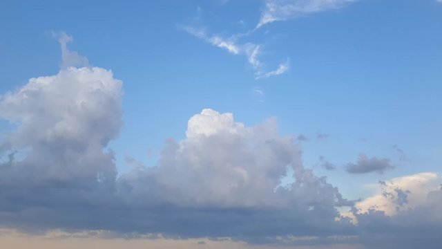 Beautiful epic cloudscape time lapse of summer thunderstorm clouds forming in 4k. Perfect as overlay, background of transition clip. Only minor noise reduction in davinci or neat image needed.