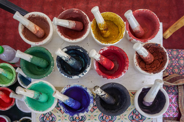 Dried watercolors in small porcelain mortars