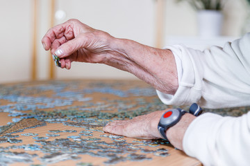Old woman laying puzzle
