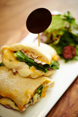 Panini sandwich with salad on plate 