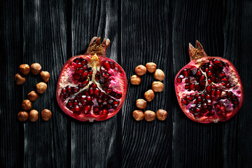 Healthy holidays food and diet. Number 2020 made from fruits and nuts. New Year and Christmas 2020 decisions about a healthy lifestyle.