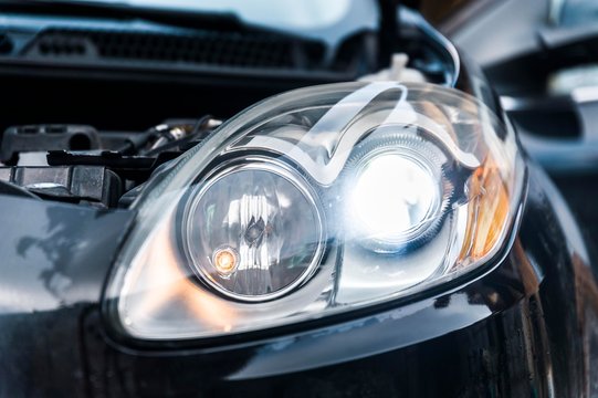 Car headlights with led light bulb. Low beam of vehicle head lights.