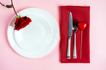 Romantic table setting for Valentines day or dinner date celebration wedding.