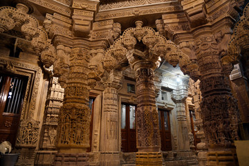Shri Mahaveer Jain temple, heavily decorated columns and bracketed arches, inside Golden Fort, Jaisalmer, Rajasthan, India