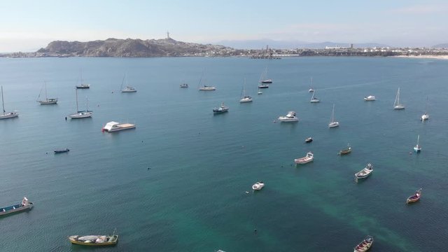 Travelling aerial shot of quiet ocean, with lots of boats.
Coquimbo, La Herradura, Chile.
4K 24fps