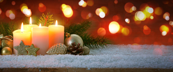 Four burning Advent candles and decoration. . Christmas background.