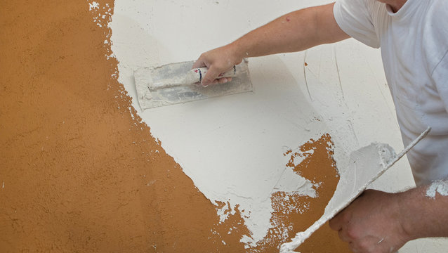 Plastering walls. Plasterer.  Plaster. Renovation. Building.