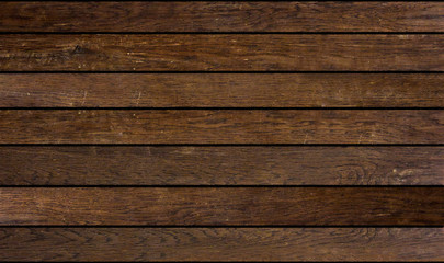 Old grunge dark textured wooden background, top view brown paneling. Vintage