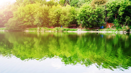 Rest zone. A beautiful lake in a city park. Summer time