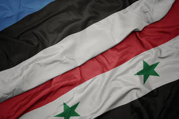 waving colorful flag of syria and national flag of estonia.