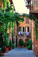 Fototapeta na wymiar Romantic corner in a quiet and cozy street of Trestevere, in Rome