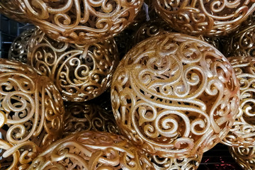 texture gold yellow shiny patterned Christmas new year tree toys balls, decorations for the Christmas tree. close-up, soft focus.