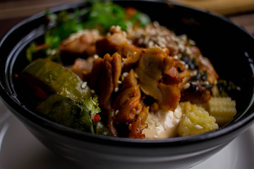 chicken poke with seaweed. chicken dish with sesame rice and seaweed.
