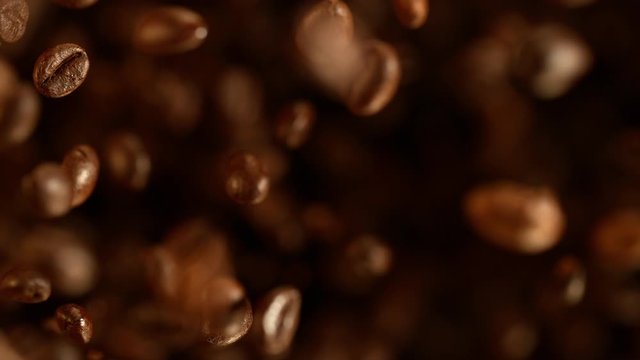 Super slow motion of flying coffee beans. Filmed on high speed cinema camera, 1000 fps. 4K UHD
