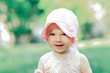 close up. portrait of a pretty little in panama-hat