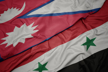 waving colorful flag of syria and national flag of nepal.