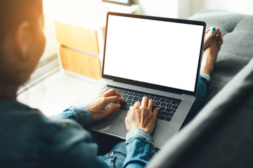 mockup image blank screen computer with blank white background for advertising text,hand man using...