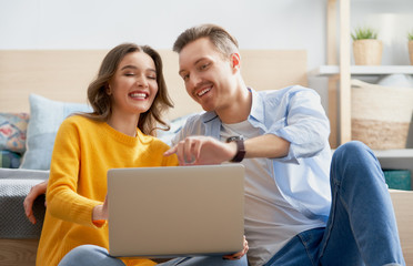 couple is using a laptop