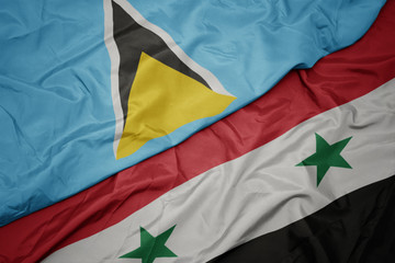 waving colorful flag of syria and national flag of saint lucia.