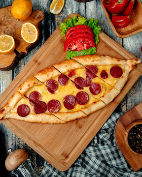 Sliced Pide With Sujuk On A Wooden Board