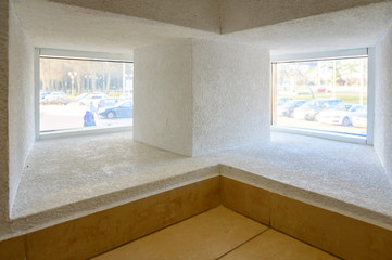 Photo of a double corner window in a building.