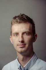 Fototapeta premium Portrait of a smart serious young man