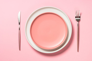 Table setting on pink top view.