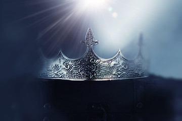 mysterious and magical photo of of beautiful queen/king crown over gothic snowy dark background....