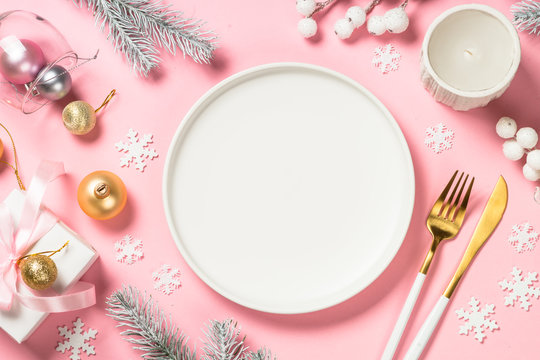 Christmas Table Setting On Pink Top View.