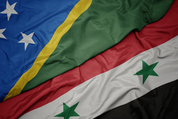 waving colorful flag of syria and national flag of Solomon Islands .