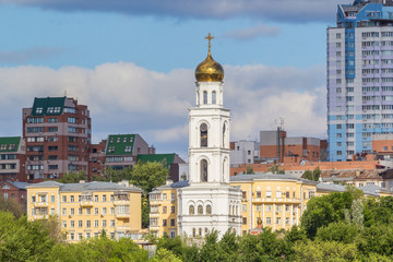 Fototapeta na wymiar View of the bell tower of the Iversky monastery in Samara