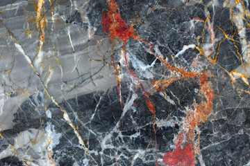 Gold, red and white patterned natural of dark gray marble pattern background texture for product design.