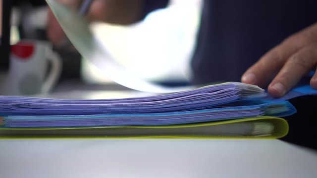 Businessman holding stack files folders of document and paperwork financial from storage archive in binders office desk for study, business administration management information concept. 4k