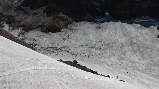 Kamchatka Peninsula, nature of Russia. Snow in the mountains. Volcano Mutnovsky. Video shooting from a drone. UNESCO world natural and cultural heritage. 