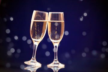 Two champagne glasses ready to bring in the New Year