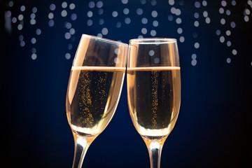 Two champagne glasses ready to bring in the New Year