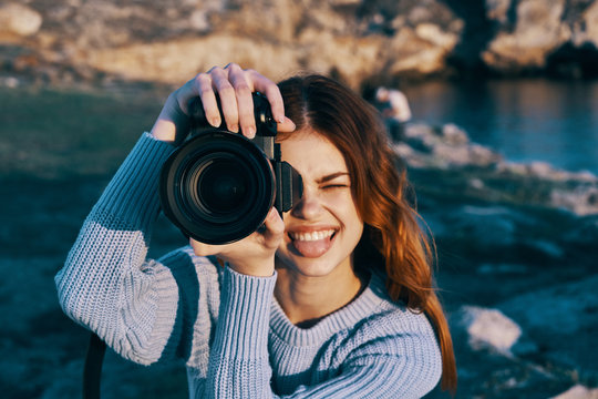 woman taking photo with digital camera